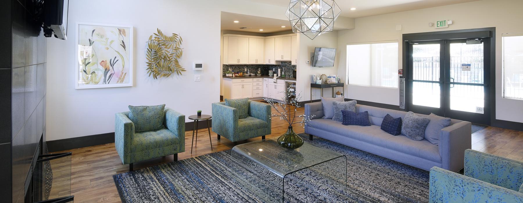 a lounge room with a rug and couches